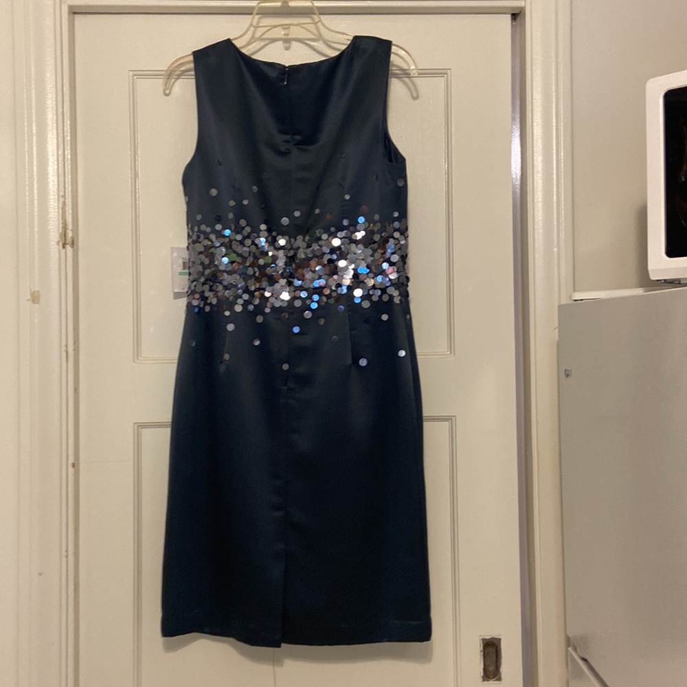 S 8 drk bl classic Calvin Klein below the knee evening wear.